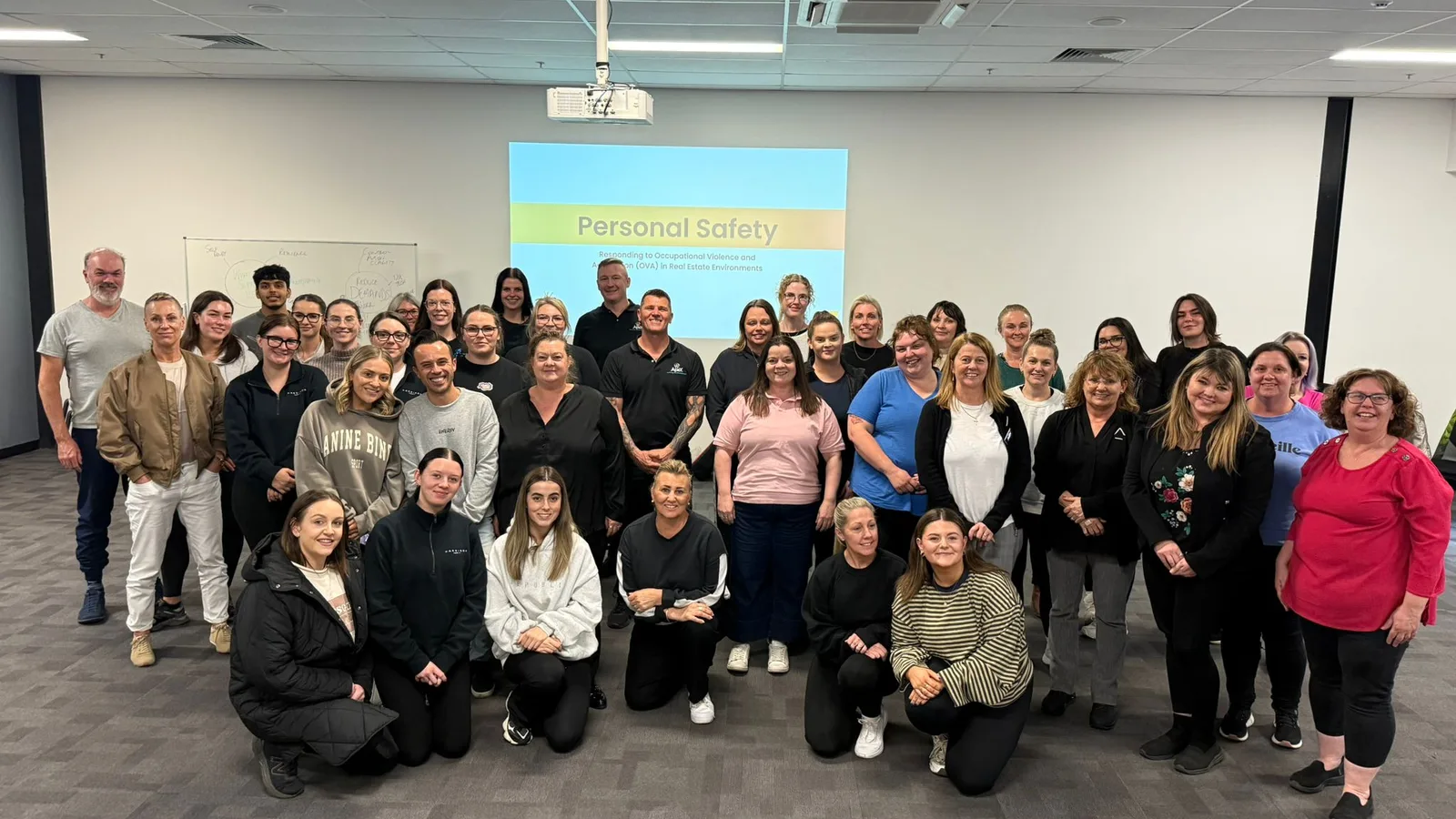 A large group of participants and Apex trainers after a Personal Safety Program workshop