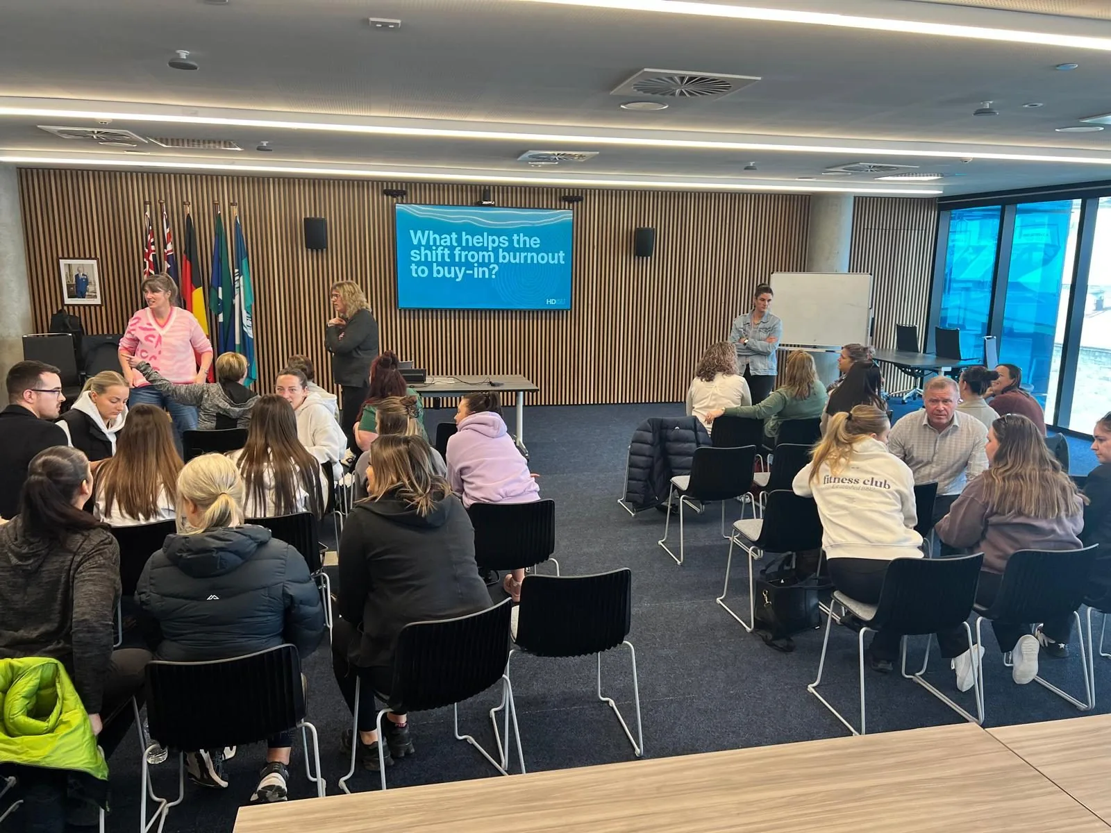 Participants in a workplace wellbeing discussion at an Apex session